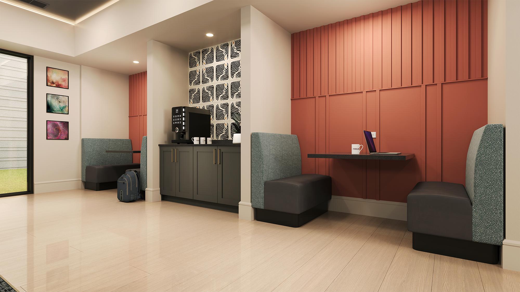 Sterling Tiger Valley Modern lounge area with two booth seating spaces, a coffee station, a backpack, and a laptop on a table.