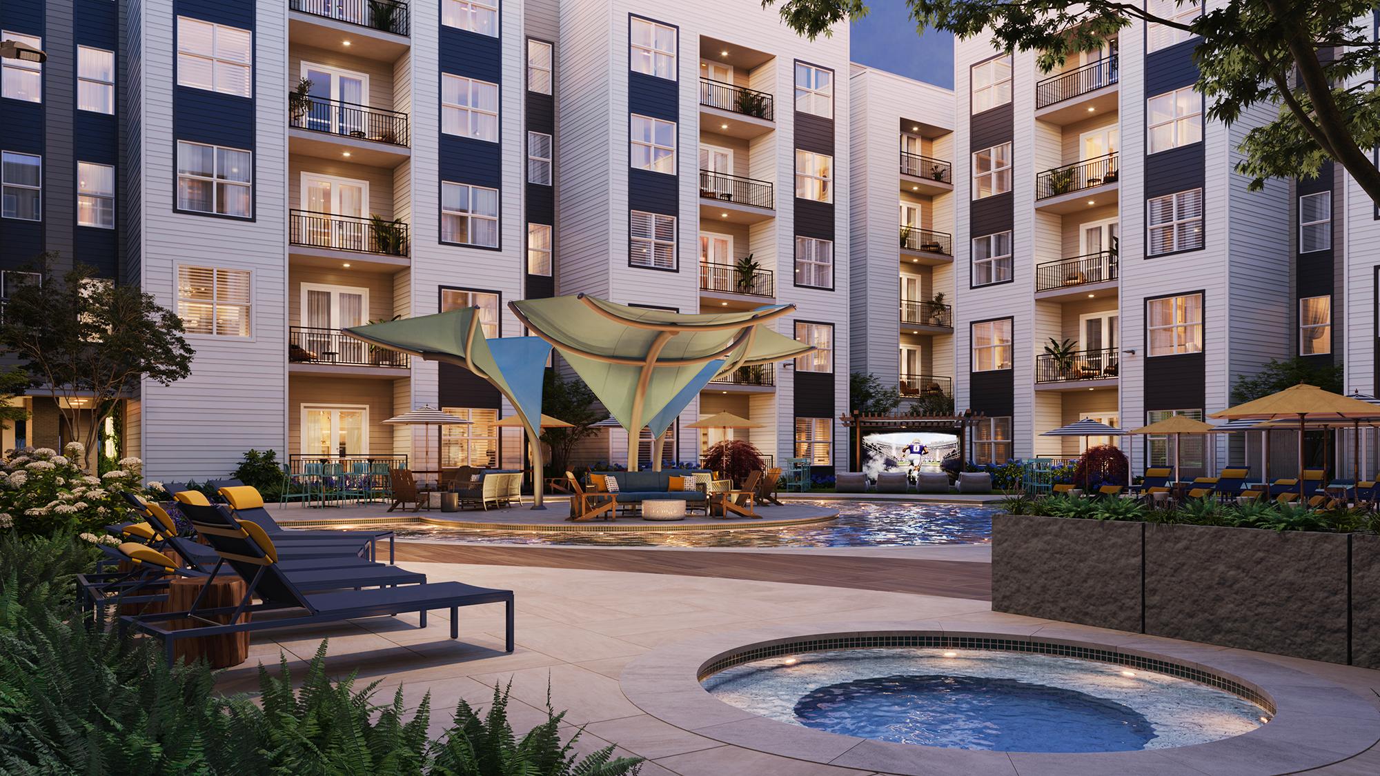 Sterling Tiger Valley Modern apartment courtyard at dusk with a pool, lounge chairs, umbrellas, and a hot tub, surrounded by greenery and multi-story buildings.