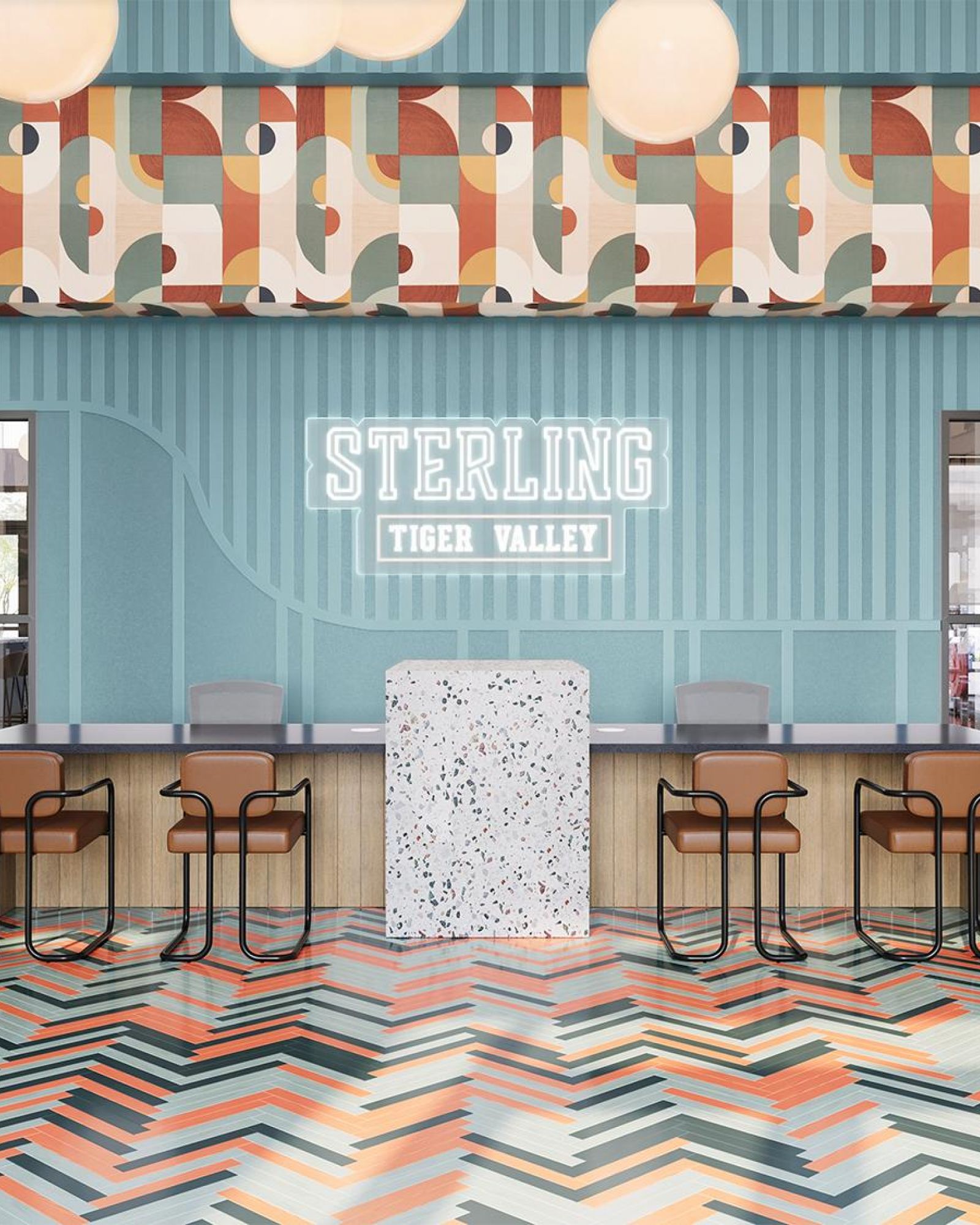 Sterling Tiger Valley Modern lobby with patterned floors, geometric wall art, bar seating, and a neon sign reading "Sterling Tiger Valley" behind the counter.